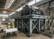 Fabricated steel support structure beneath heavy industrial equipment